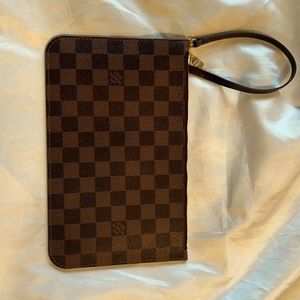 LV pouch with strap to be worn as a wristlet.Also attaches to Neverfull.